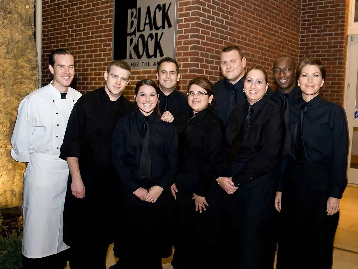 A Group of Restaurant Staff in Black Color Shirts