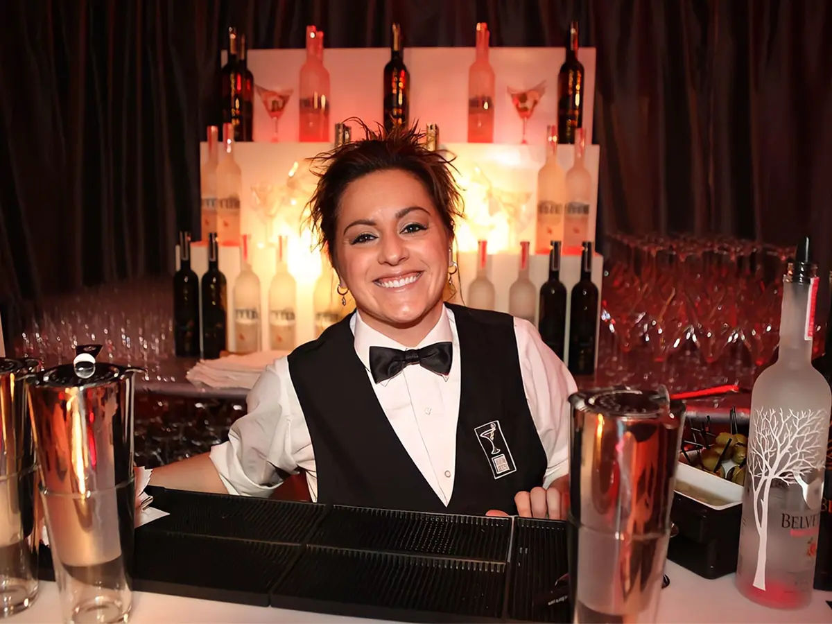 A Woman With Spiky Hair Standing Behind a Bar Counter